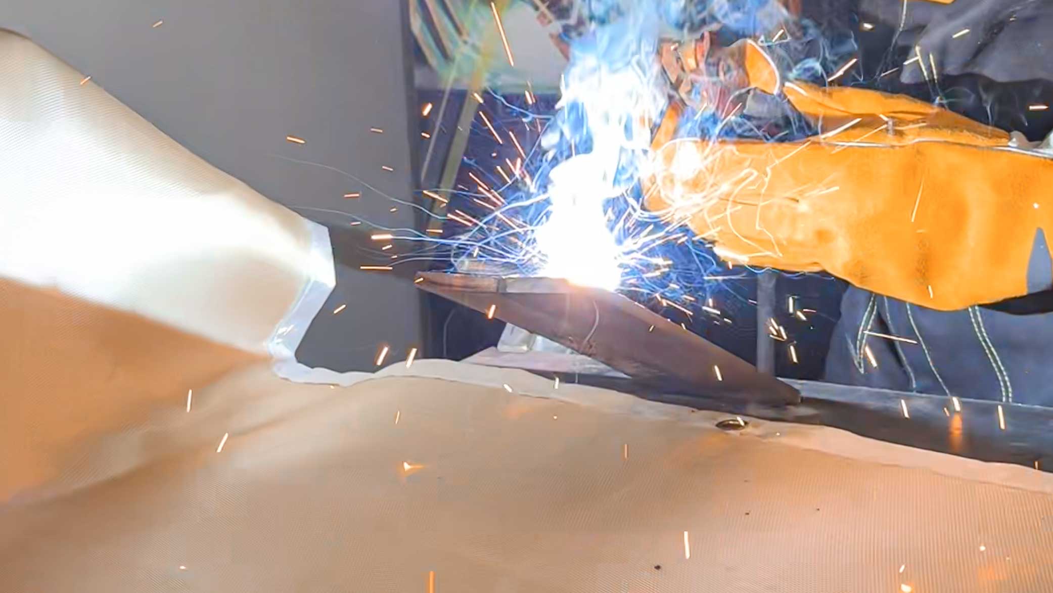 Welding blanket shielding sparks during hot work